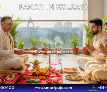 Traditional Bengali Purohit performing Annaprashan ceremony in a Kolkata home.