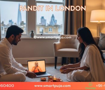 Couple in London apartment performing Satyanarayan Puja online.